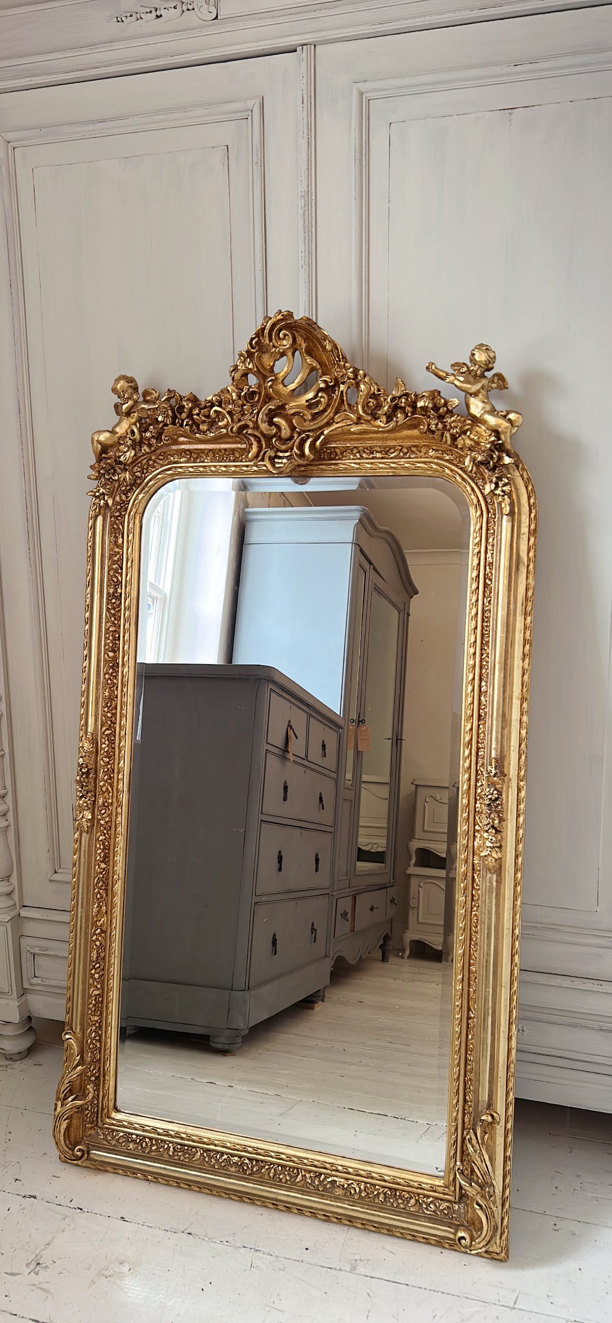 Ornate cherub gold mirror