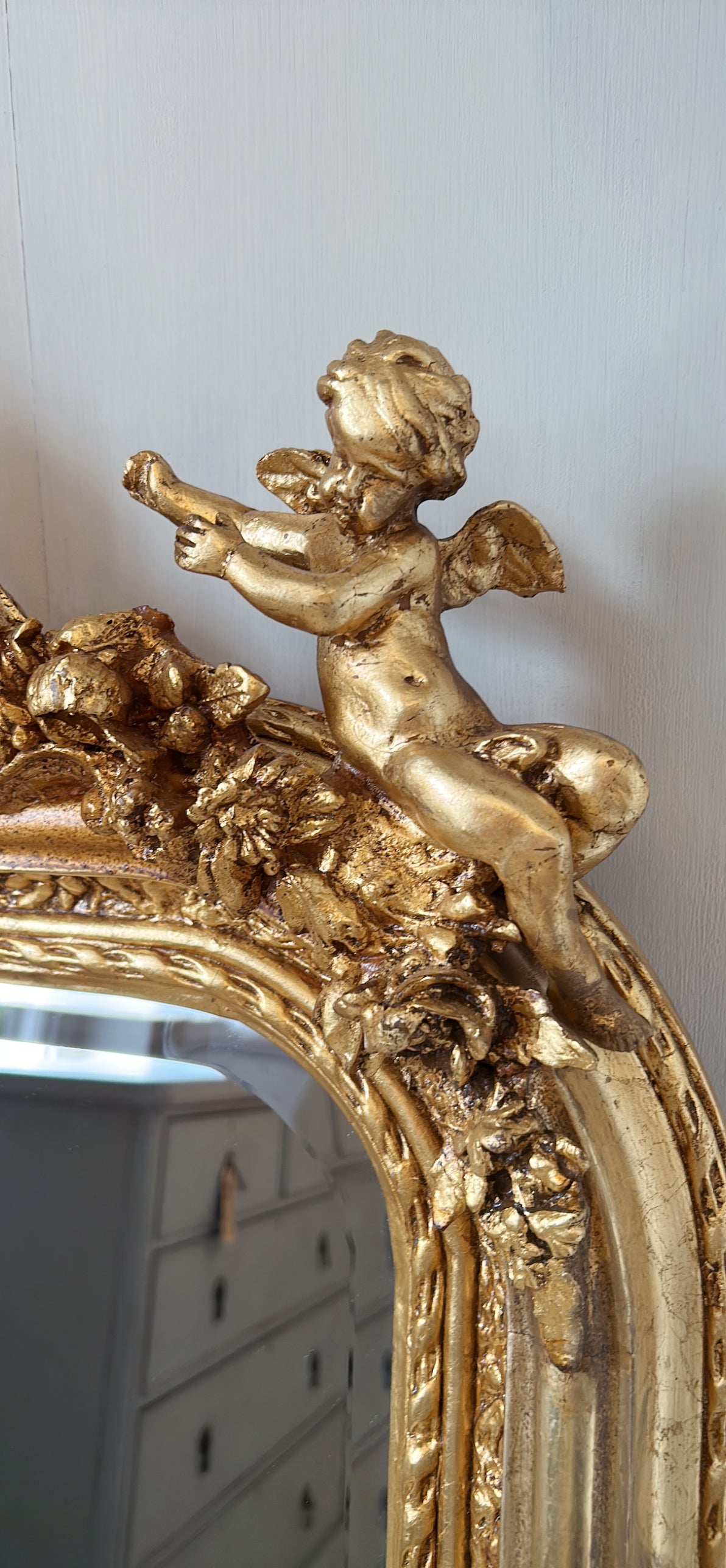 Ornate cherub gold mirror