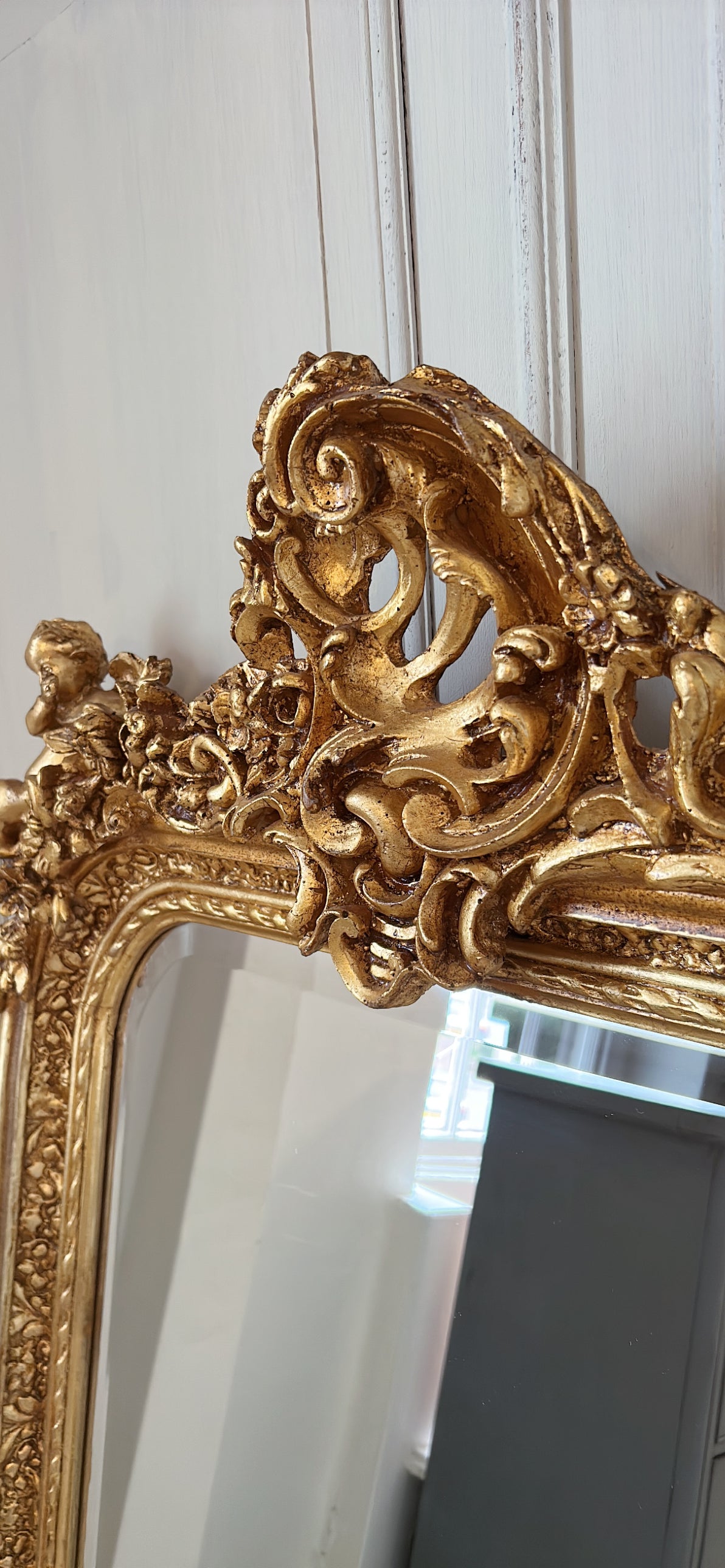 Ornate cherub gold mirror