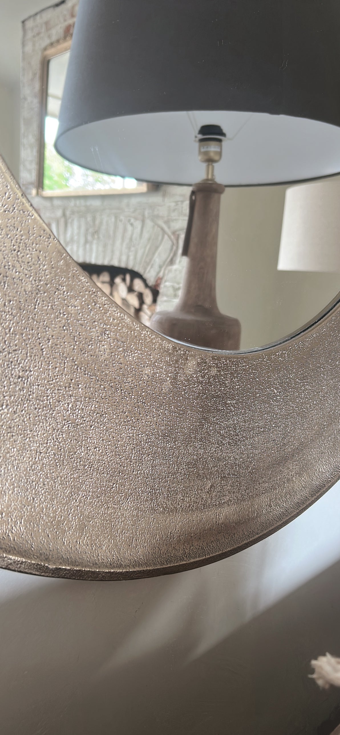 Hammered gold round mirror