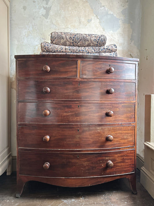 Antique Mahogany bow font chest of drawers